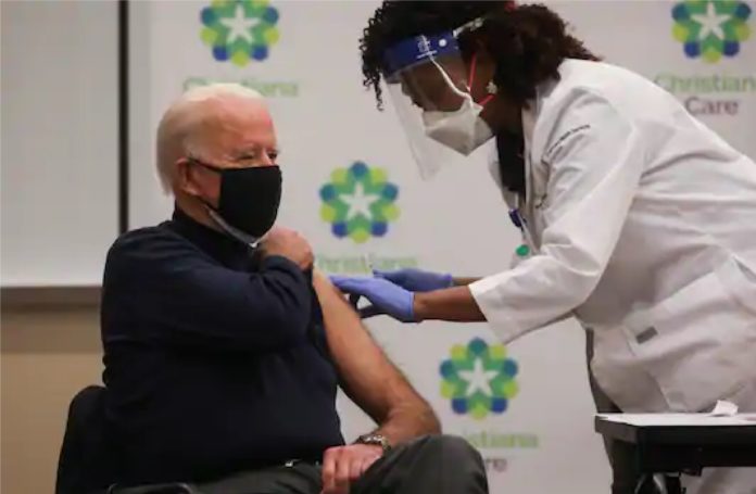 Joe Biden receives first dose of Covid-19 vaccine on live television