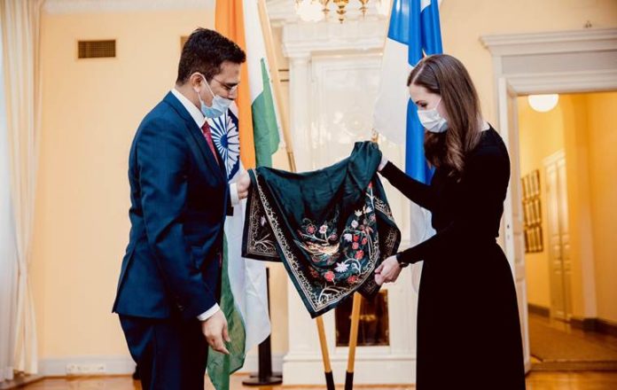 Raveesh Kumar calls on Finland PM, presents silk scarf handmade in Lucknow