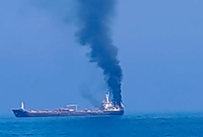 Smoke emanates from a vessel after being attacked